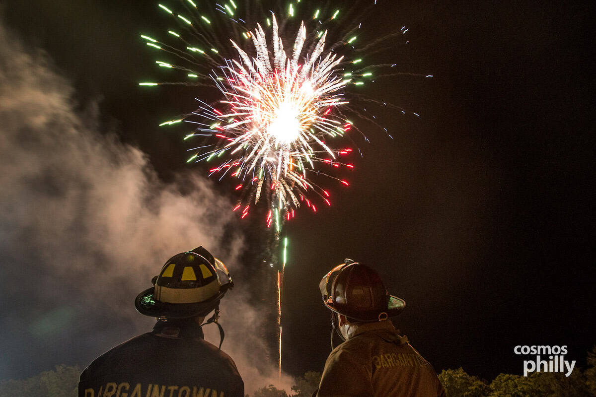 Fireworks over the Holy Trinity Greek Festival in Egg Harbor Township as firefighters watch
