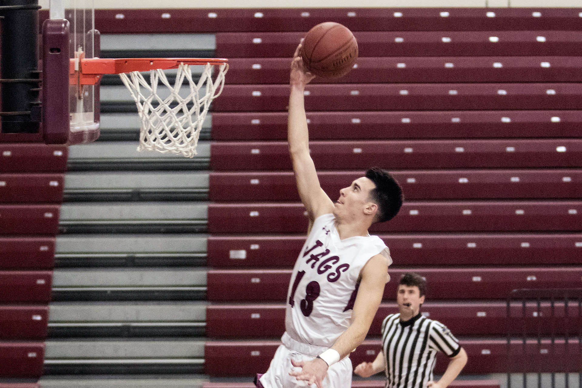 Greg Vlassopoulos above the rim on a layup against Strath Haven