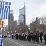 Greek Independence Day parade in Philadelphia featuring flags and community members in 2019.