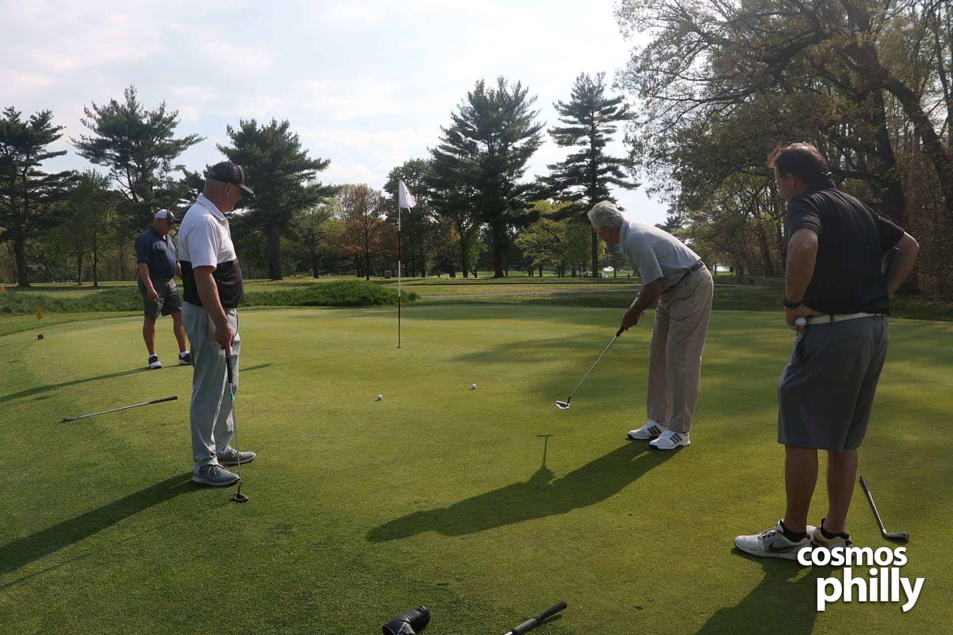 Golfers on the putting green during the 2022 St. Thomas Greek Orthodox Church golf outing.