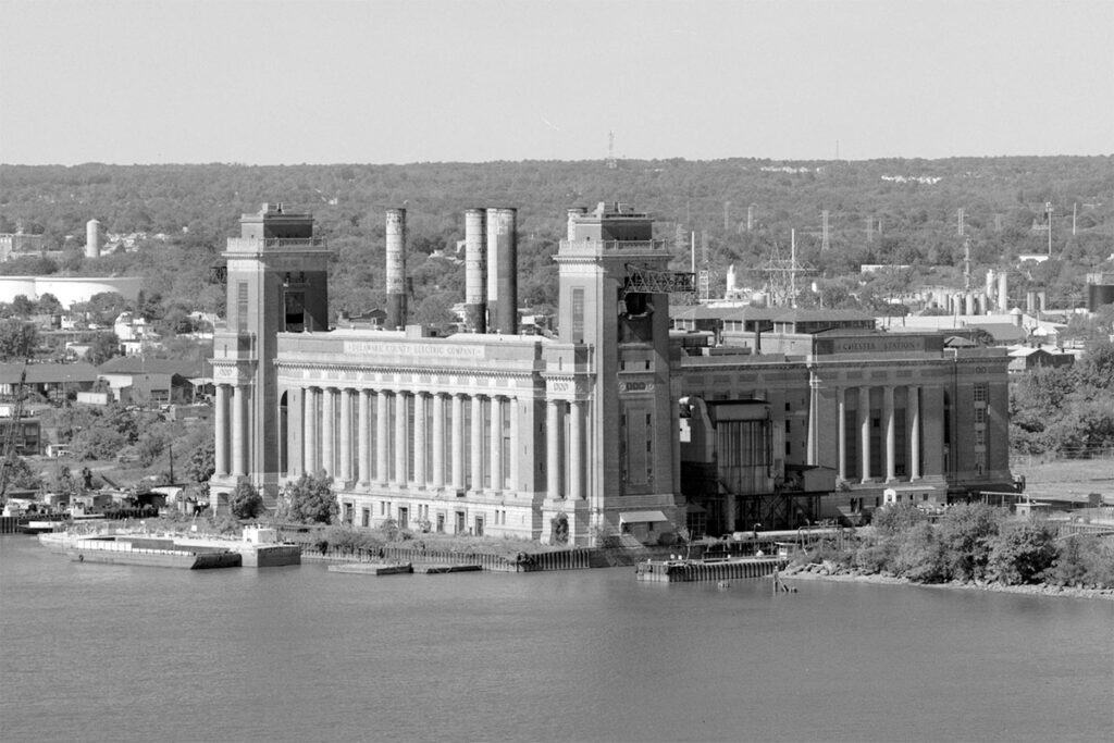Chester, Pennsylvania’s industrial skyline along the Delaware River, showing shipyards, smokestacks, and factories.