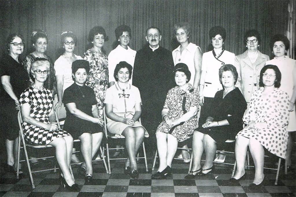 Father Athanase Devedjakis with members of the Philoptochos Society at St. George Greek Orthodox Church, Chester, Pennsylvania, 1971.