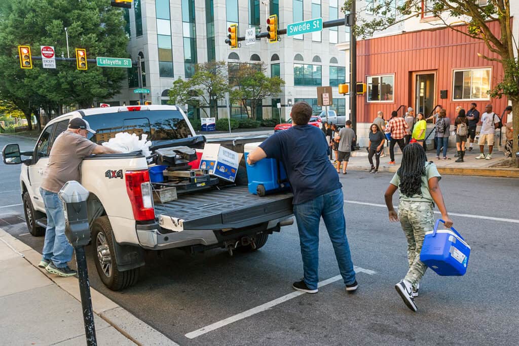 John Pogas and volunteers unloading meals outside the Upper Room at 201 Swede Street, Norristown.