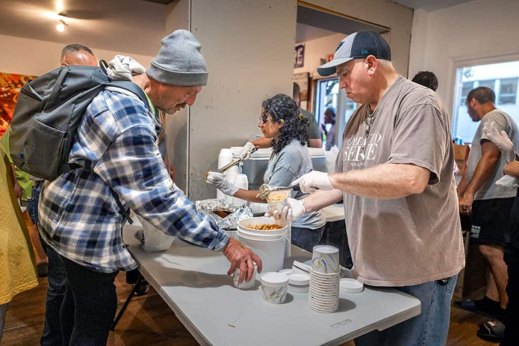John Pogas serving meals to community members at the Upper Room in Norristown.