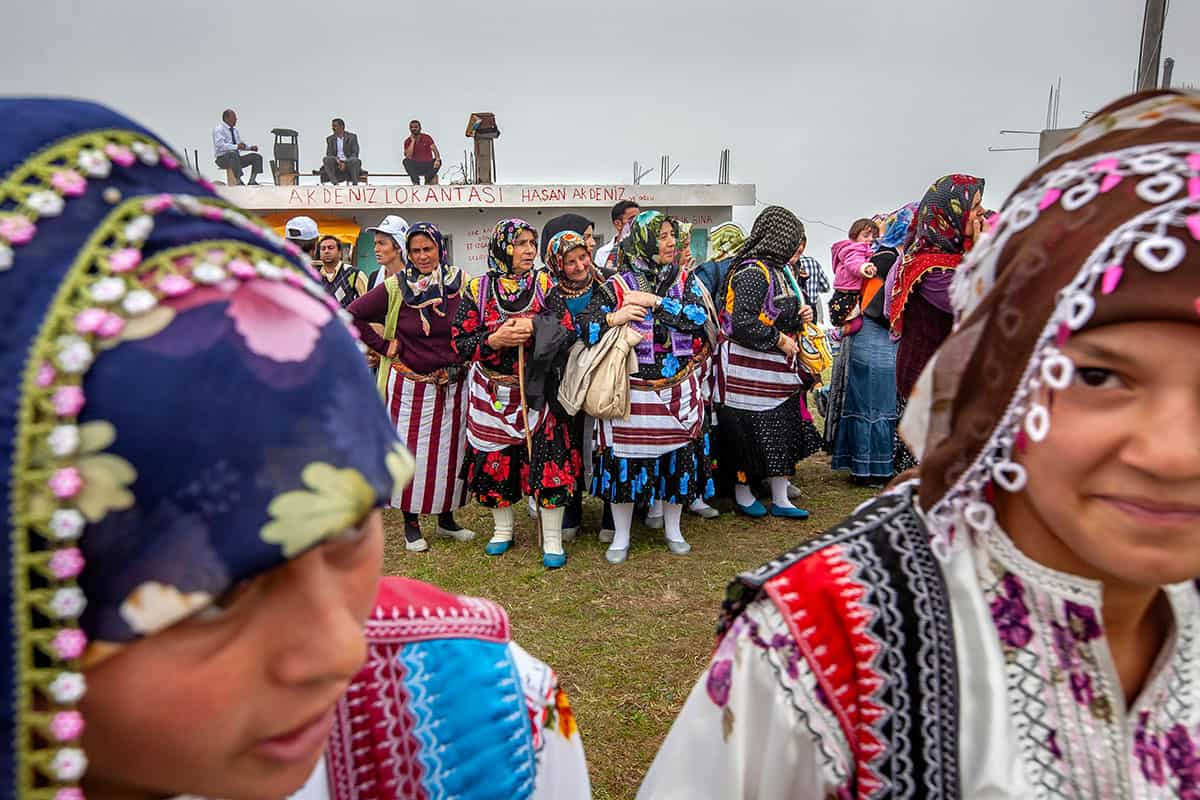Women in colorful Pontic highland costumes at the Kadırga Festival in Trabzon, Turkey.