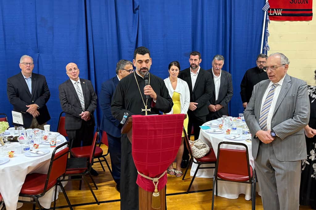 Father Avgoustinos delivering his closing remarks at the farewell luncheon in Cherry Hill