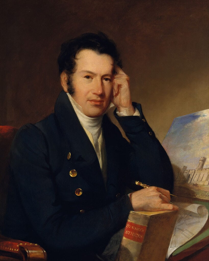 Portrait of architect John Haviland seated with book and drawings.