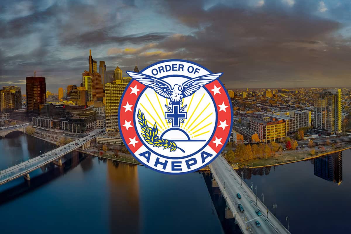 Order of AHEPA emblem over a sunset aerial view of downtown Philadelphia and the Schuylkill River