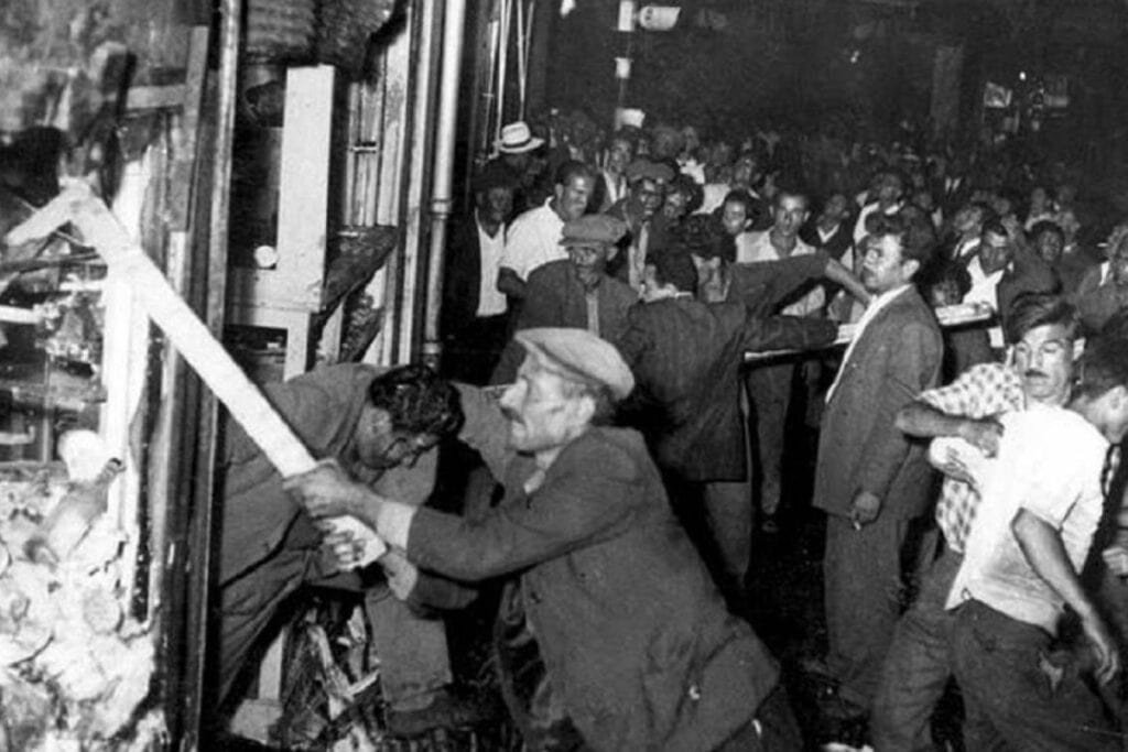 Crowd of men attacking and looting a Greek-owned shop in Constantinople during the September 1955 pogrom.