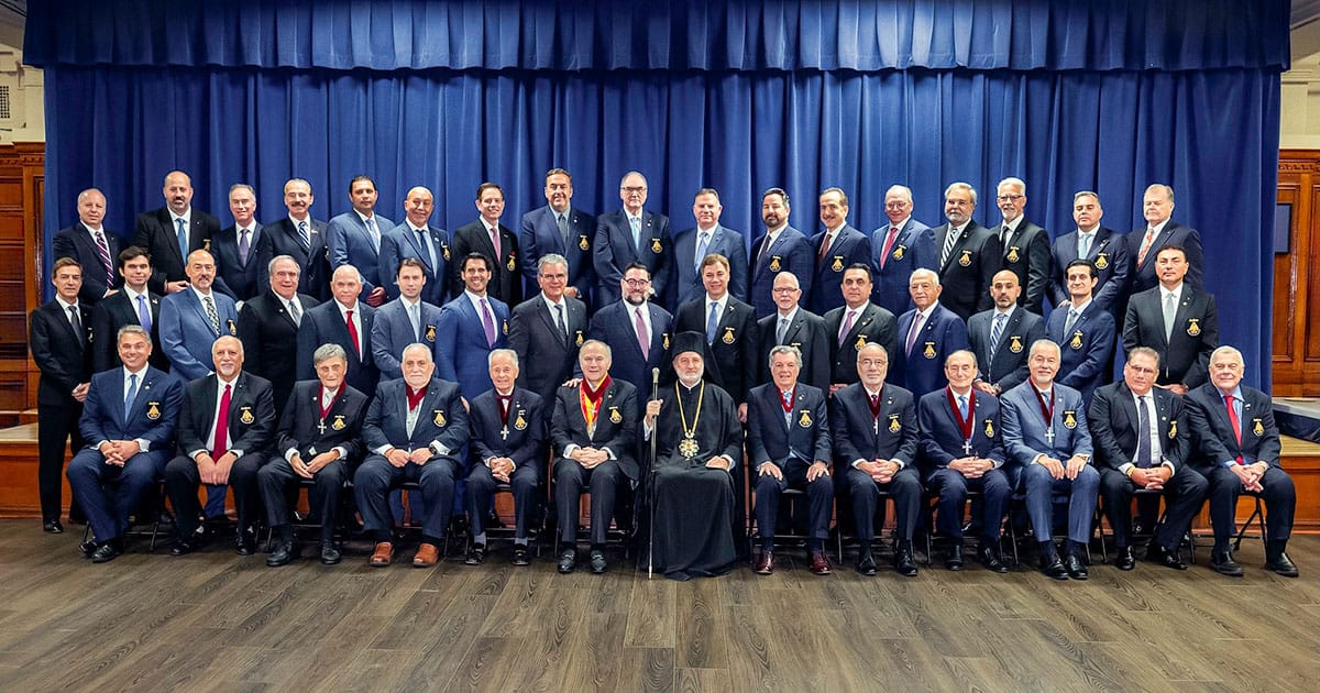 Archbishop Elpidophoros and clergy join the newly invested Archons for a formal group photo at Holy Trinity Cathedral in New York.