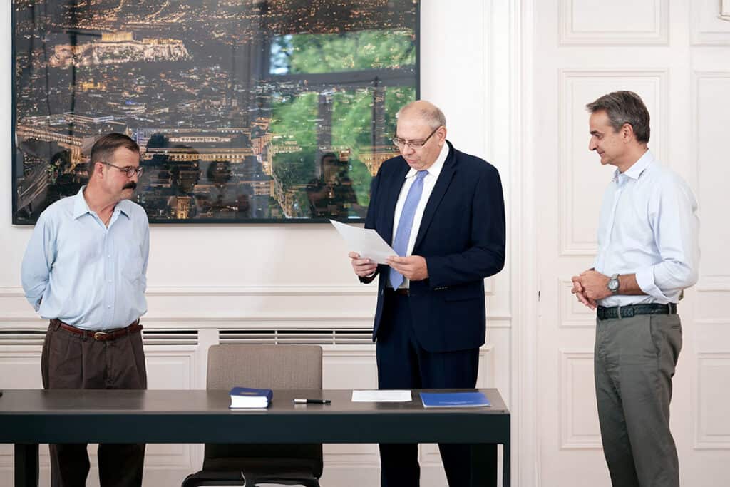 Christopher C. King at Maximos Mansion in Athens receiving honorary Greek citizenship on July 11 2022, in the presence of Prime Minister Kyriakos Mitsotakis and Secretary General for Citizenship Athanasios Balerbas.