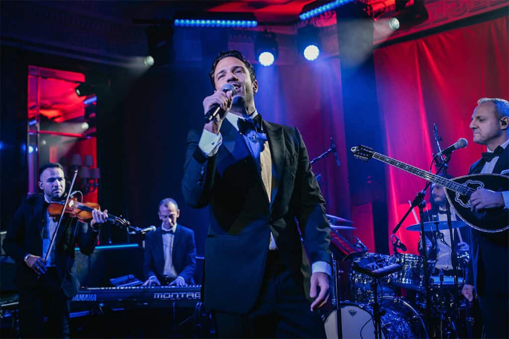 Konstantinos Argiros performing on stage with his band during The Hellenic Initiative’s 9th Annual London Gala.