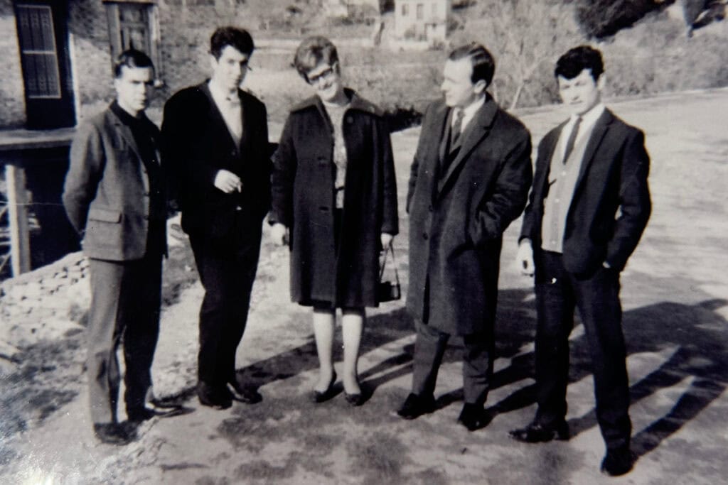 Young John Kontaxis standing with friends and relatives in Samos, Greece, before emigrating to the United States.