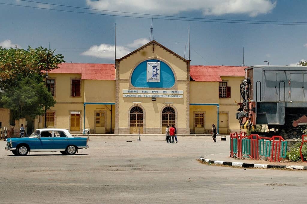 Dire Dawa train station in Ethiopia, built in 1897 for the Ethio-Djibouti Railway, with the historic façade and railway cars visible.