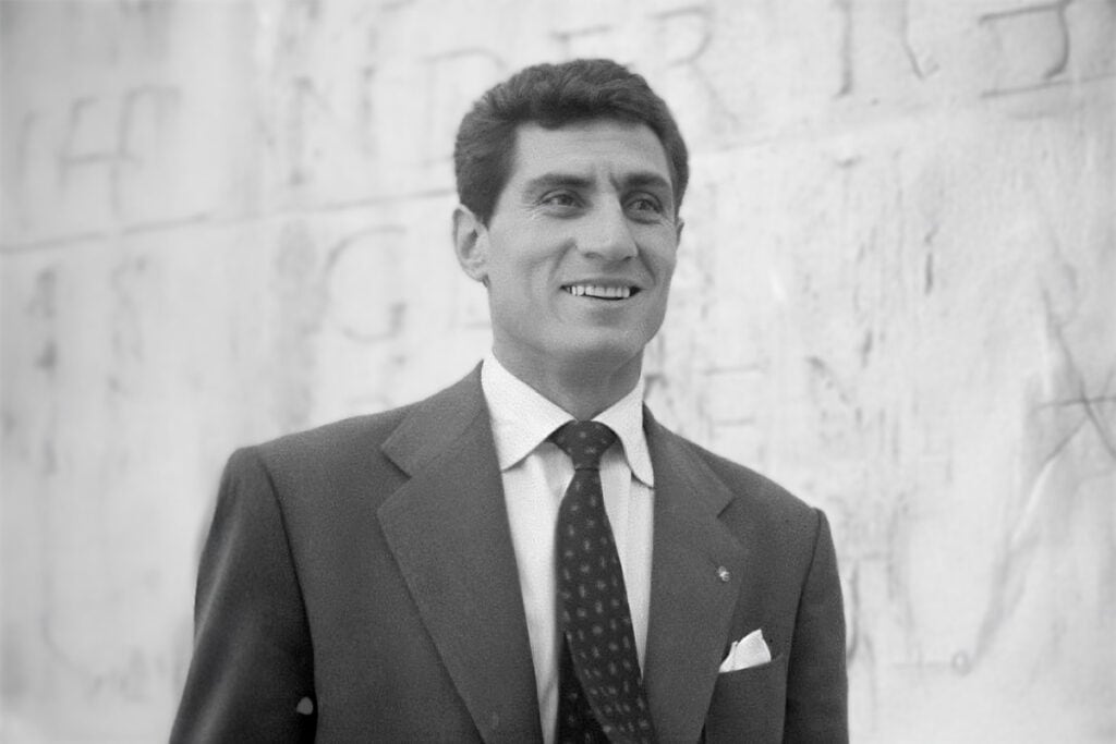 Lefter Küçükandonyadis in a suit, photographed in the late 1950s.
