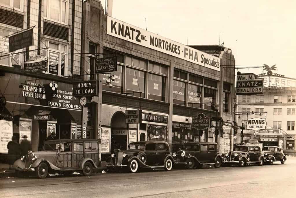 Historic view of Market Street in Upper Darby during the late 1930s, showing storefronts including Williams and Wells-Stevens Hats.