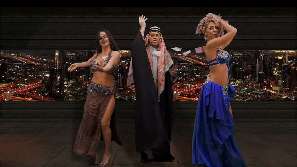 Screenshot from the Greek music video “Φεύγω για Ντουμπάι,” showing a singer and dancers performing in front of a stylized Dubai city skyline.