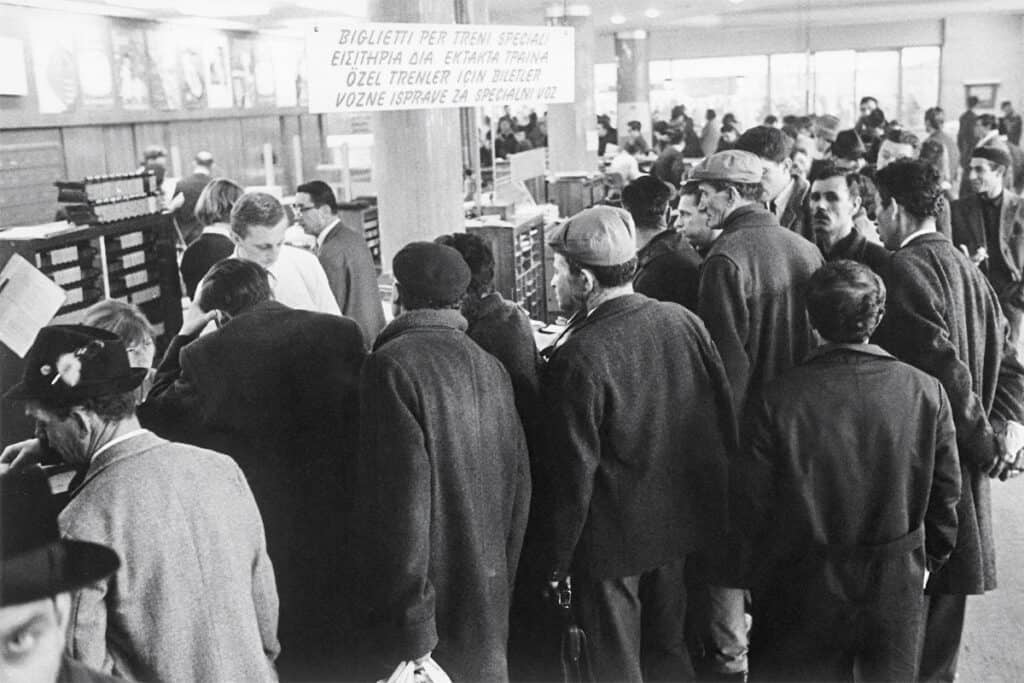 Guest workers waiting at the ticket counter of Munich Central Station before Christmas in December 1965 to buy tickets to return home.