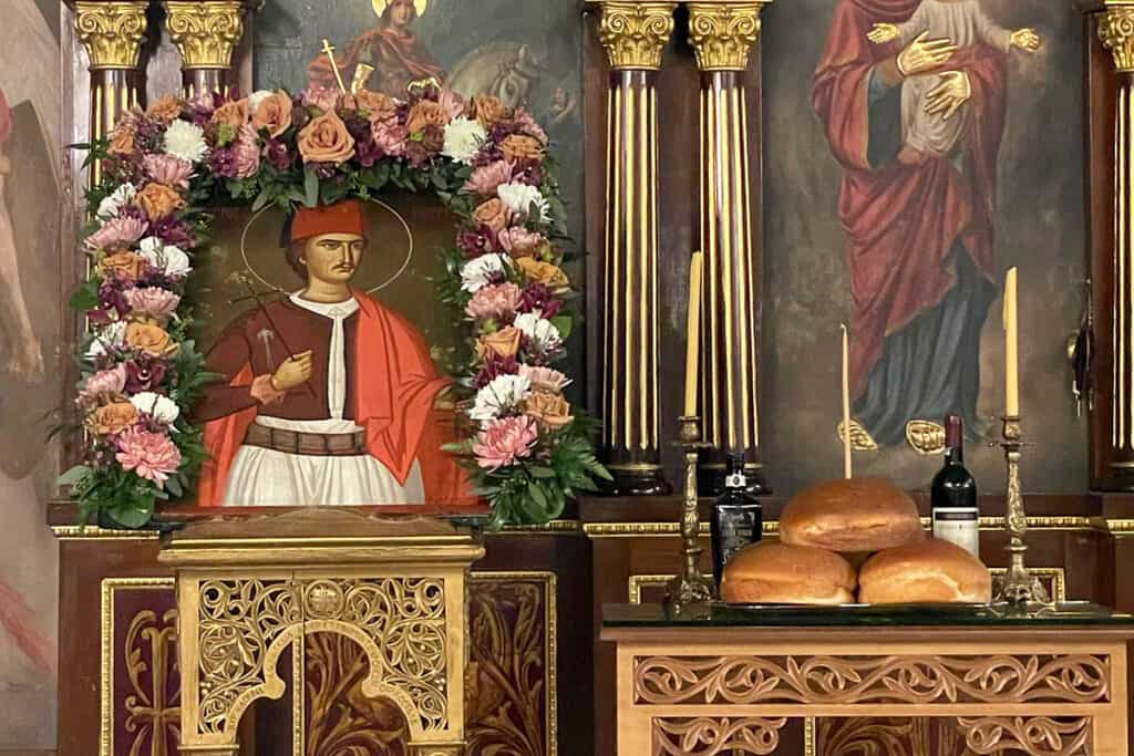 Icon of Agios Georgios of Ioannina decorated with flowers during the Vasilopita service at St. George Greek Orthodox Cathedral in Philadelphia.