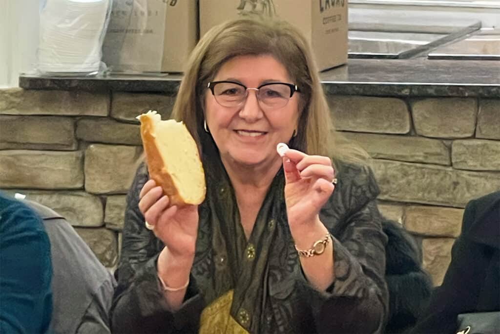 Sofia Steperouva holds the flouri after finding the lucky coin in the 2026 Vasilopita.