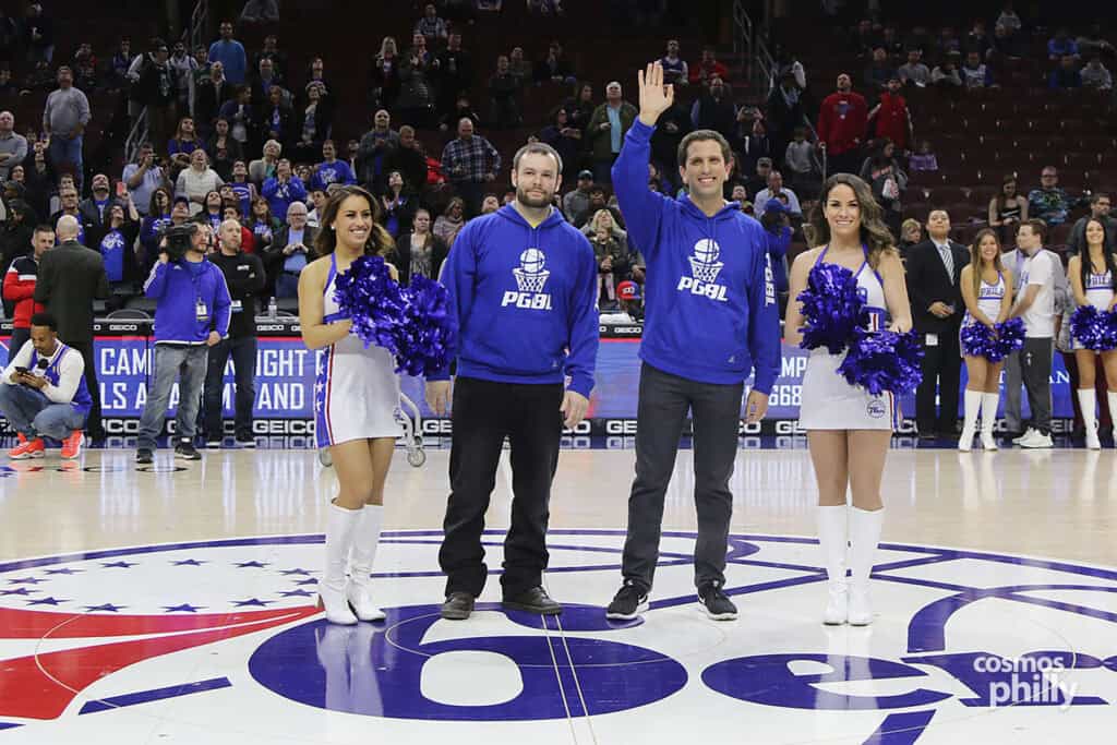 Members of the Philadelphia Greek Basketball League are honored at center court alongside 76ers cheerleaders during Greek Heritage Night.