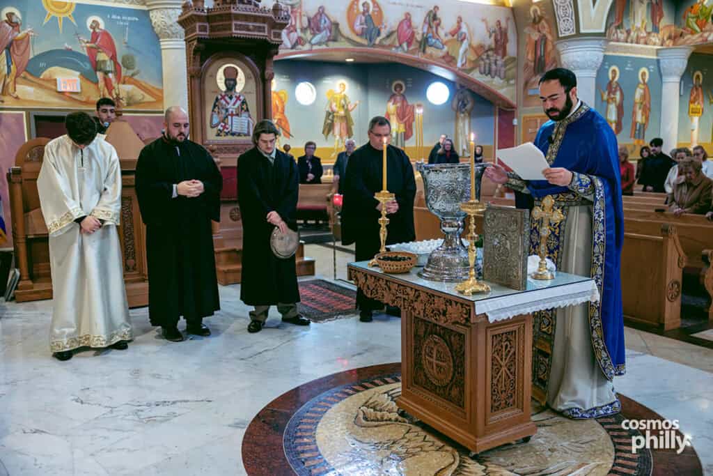 Orthodox priest leads the Great Blessing of the Waters inside St. Sophia Greek Orthodox Church during the Theophany service.