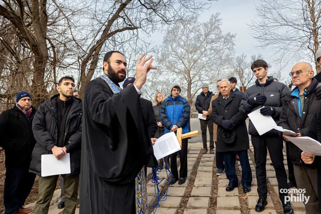 Clergy and parishioners gather along the riverbank for prayers before the blessing of the waters.