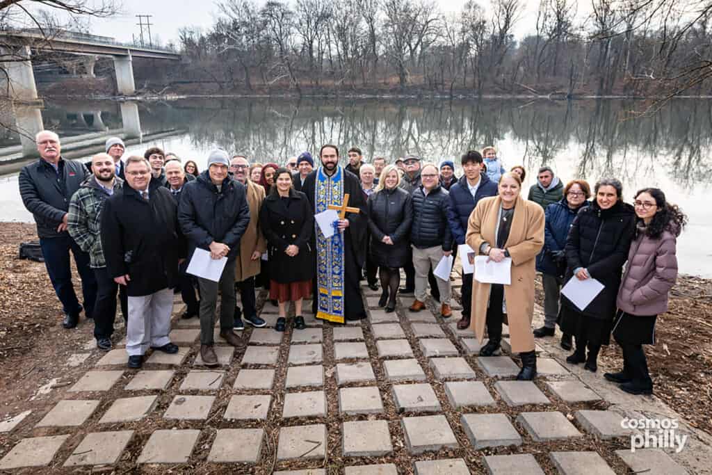 Parishioners pose for a group photo along the Schuylkill River after the Theophany blessing.