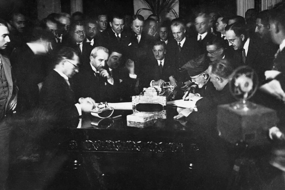 Delegates sign the Treaty of Lausanne in July 1923, with Eleftherios Venizelos visible at the table