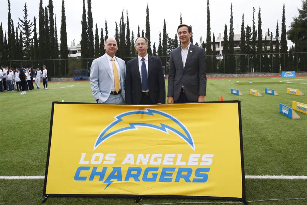 Officials attend the Los Angeles Chargers’ flag football event in Athens.