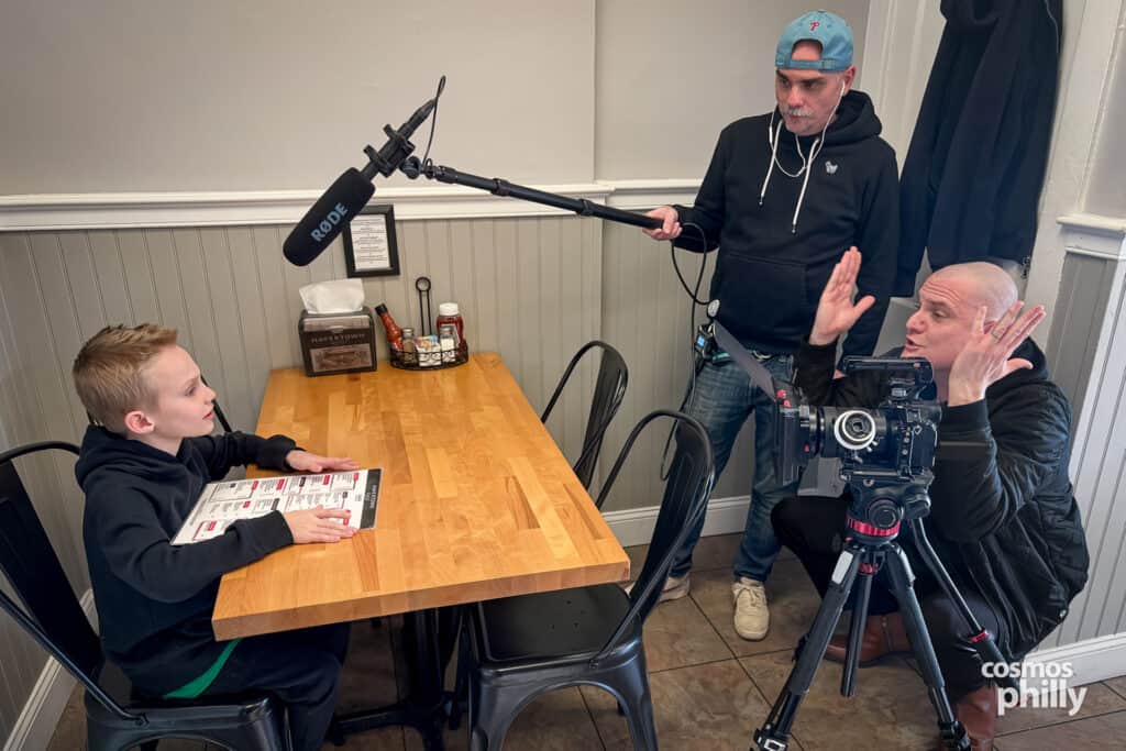 Brody, Chris Veen, and director Ray Martin during filming inside Havertown Grille