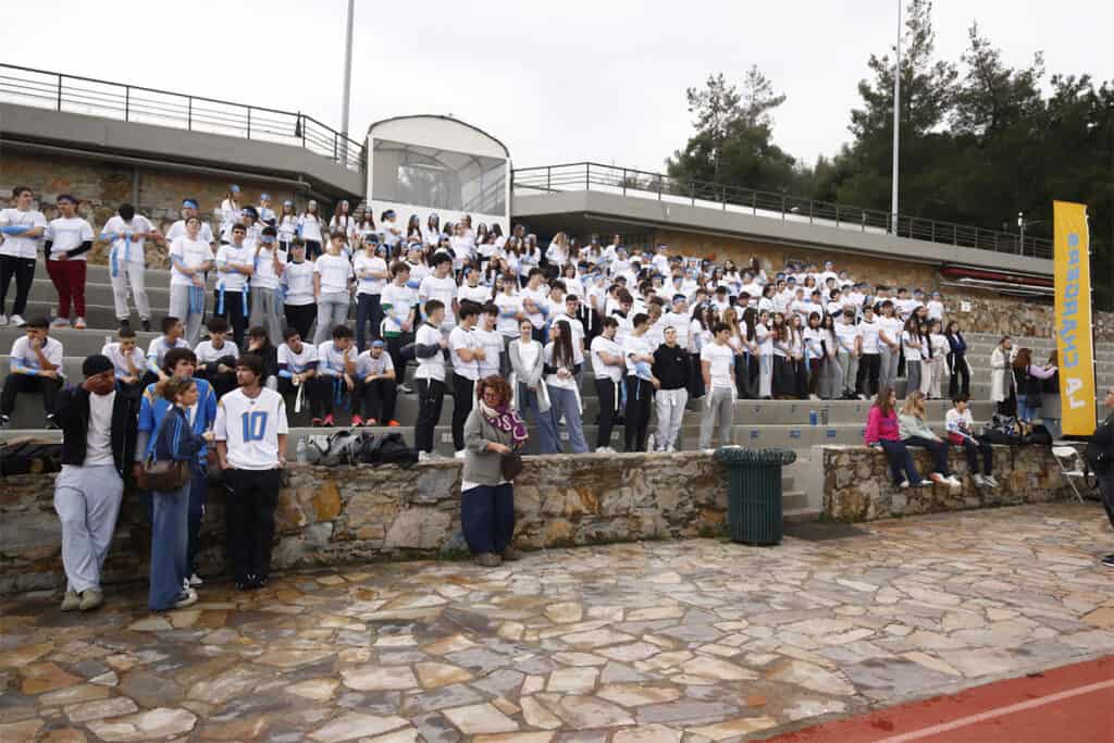 Students fill the stands during the Los Angeles Chargers’ flag football youth event in Athens.