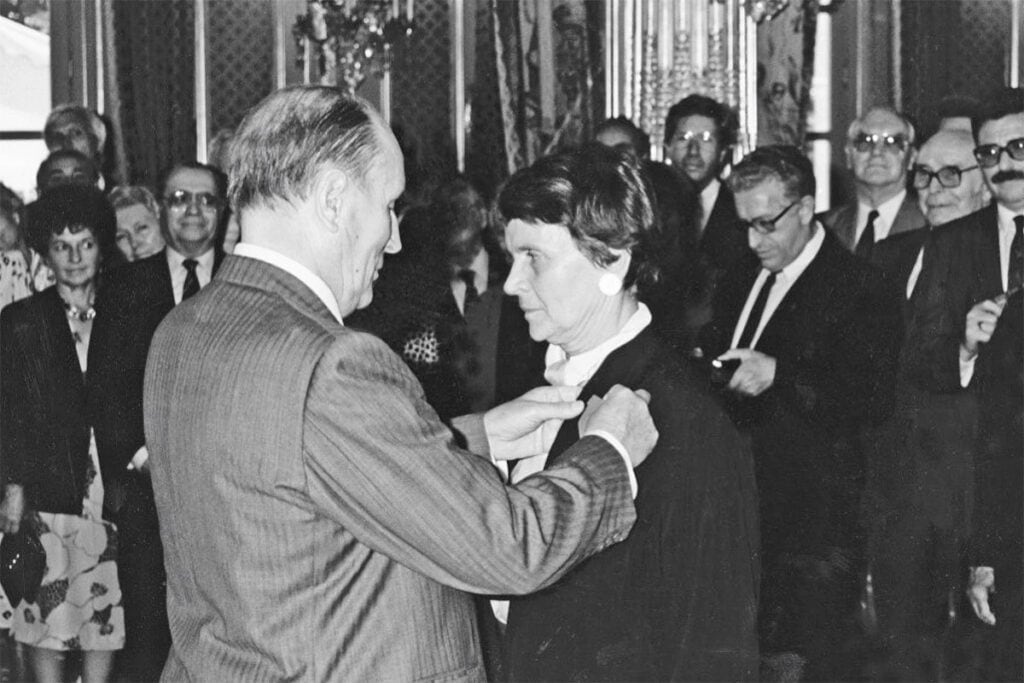 Hélène Glykatzi-Ahrweiler being decorated by French President François Mitterrand in Paris.