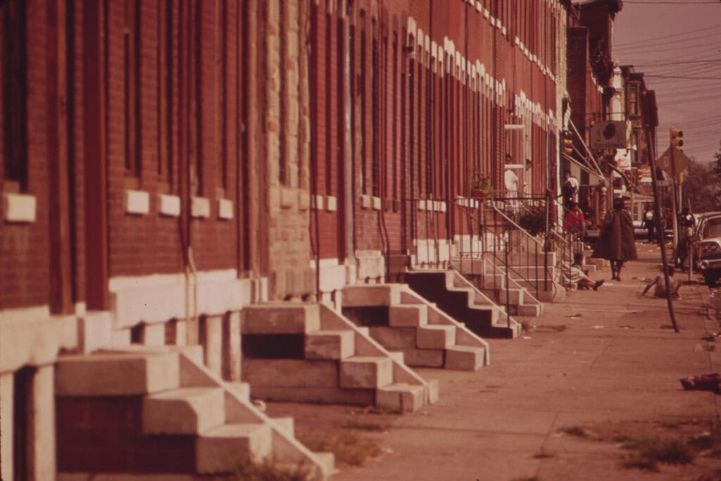 Row houses and sidewalk life in North Philadelphia, 1973
