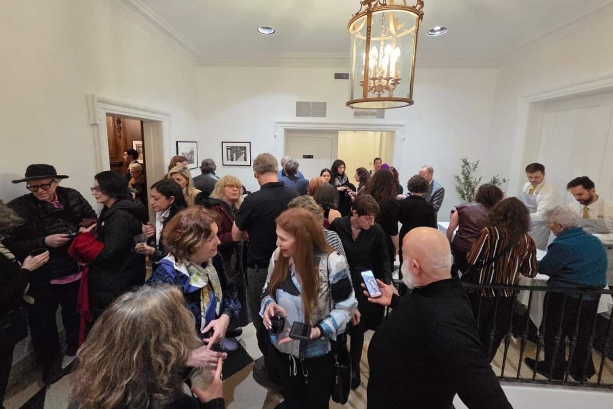 Visitors gather inside the Consulate General of Greece in New York during the opening of the Greek-American women artists exhibition.