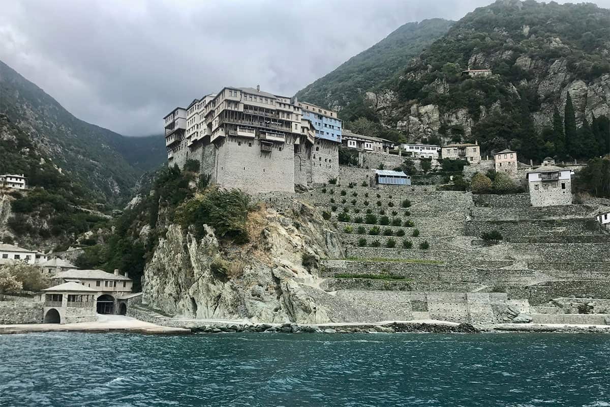 Monastery on Mount Athos rising above the sea along the Chalkidiki coastline