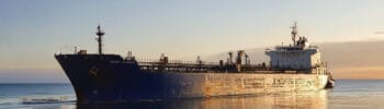 Oil tanker transporting crude oil at sea, part of global energy shipping routes through the Strait of Hormuz.