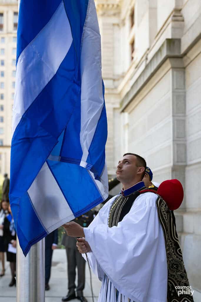 The Greek flag is raised at Philadelphia City Hall during Independence Day weekend events.