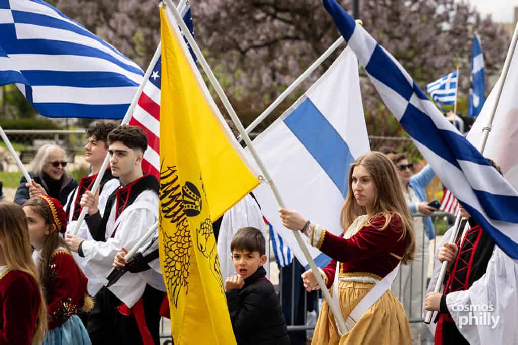 Parish communities marching with banners during the 2026 Philadelphia Greek Independence Day Parade.