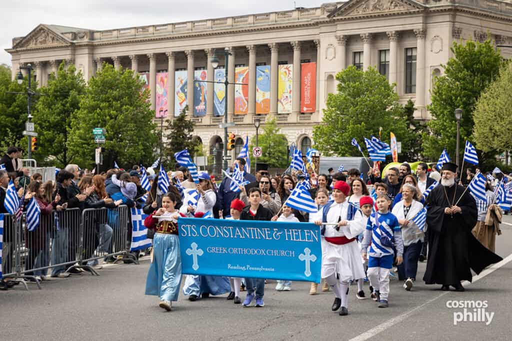 Parish communities marching with banners during the 2026 Philadelphia Greek Independence Day Parade.