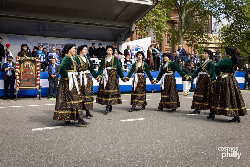 Greek dance groups in traditional dress during the 2026 Philadelphia Greek Independence Day Parade.