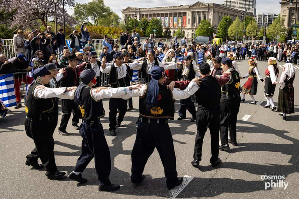Greek dance groups in traditional dress during the 2026 Philadelphia Greek Independence Day Parade.