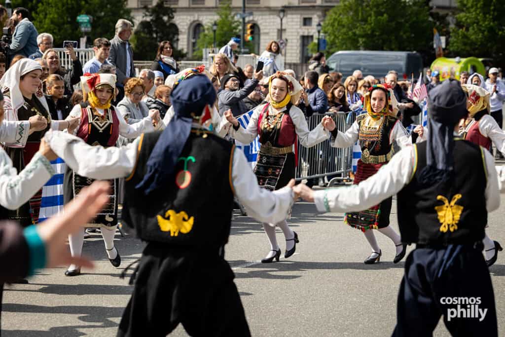 Greek dance groups in traditional dress during the 2026 Philadelphia Greek Independence Day Parade.