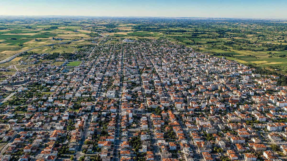 Aerial view of Orestiada in Evros, showing the town and surrounding agricultural plain.