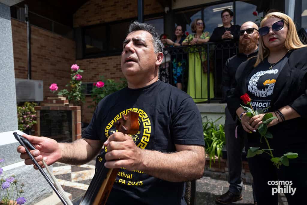 Christos Tiktapanidis plays the Pontian lyra during the outdoor commemoration at St. Demetrios.