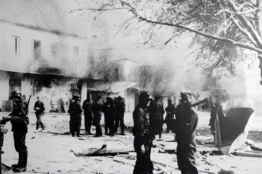 Archival black-and-white photograph showing German soldiers in Distomo during the 1944 massacre.