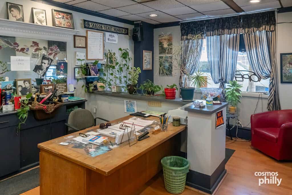 Interior of Giota’s West End Hairstyling and Barbershop in Media, Pennsylvania, with plants, mirrors, and the front counter.