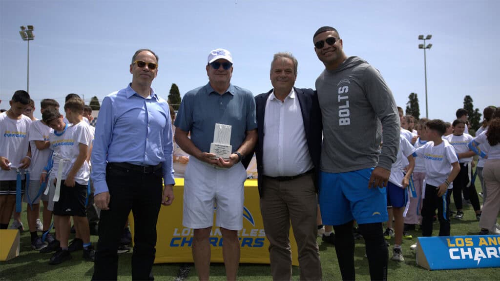 George Mavrotas, Dean Spanos, Panagiotis Karvelas, and Shawne Merriman at the Los Angeles Chargers NFL Flag Football Camp in Messinia.