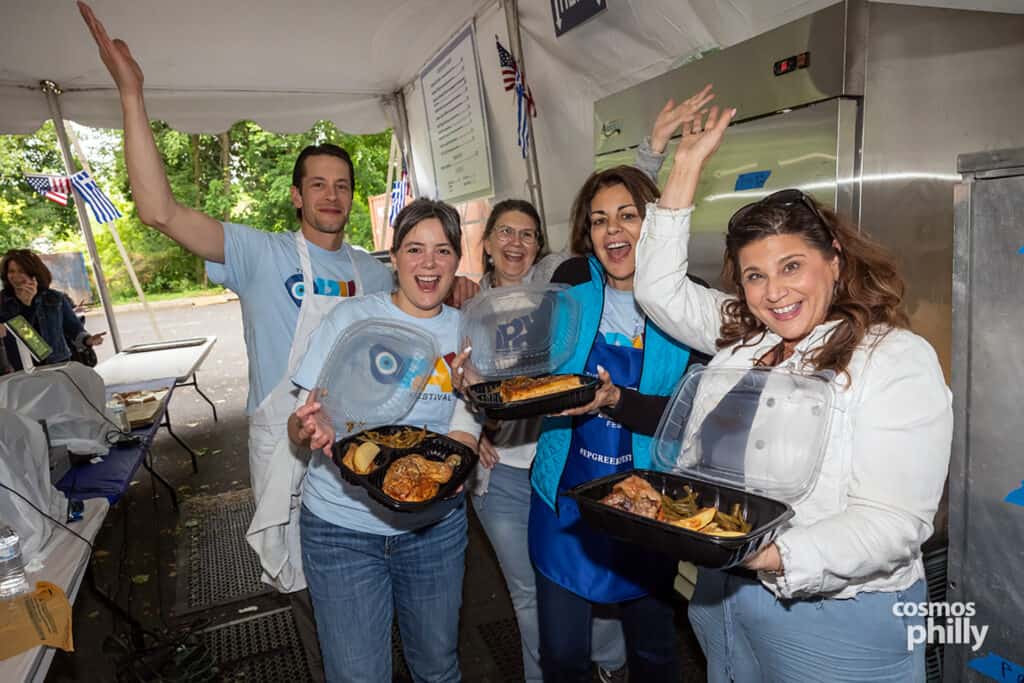 Parish volunteers serve guests during the 2026 OPA! Festival at Annunciation Greek Orthodox Church.