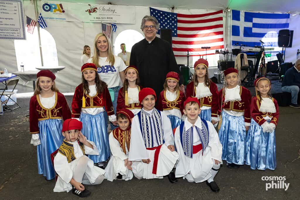 Greek dancers in traditional costumes at the 2026 OPA! Festival in Elkins Park.